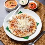 Cheese uttapam pizza, south Indian food with a twist. served with sambar and chutney