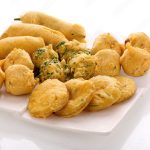 Indian Street Fried Food Pakora Also Know as Pakoda, Bhajiya, Bhajia, Methi Gota, Kanda Bhaji, Pyaz Pakoda, Fried Chillies, Onion Wada, potato vada, aloo Bhaji or fritter, Served with Chutney.