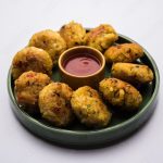 Veg Poha Cutlet or flattened Rice Patties served with tomato ketchup and green chutney